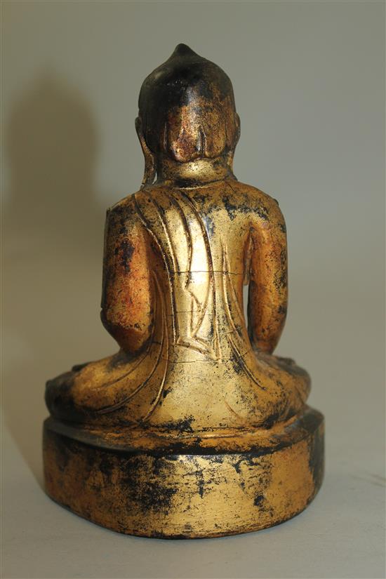 A Burmese gilt, composite and wood seated figure of Buddha, 19th century or later, 15.3cm